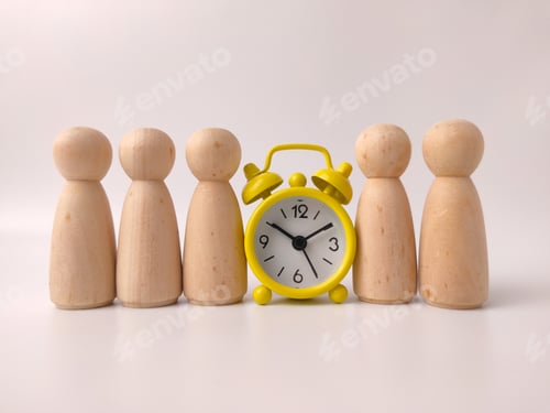 Preview: Six wooden peg doll figures lined up alongside a yellow alarm clock