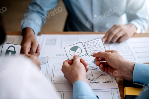 Preview: Creative website design team and application development plan on mobile phone in the Office.