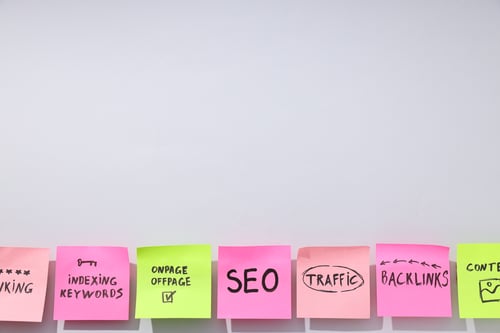 Сolored papers with words on white background, space for text