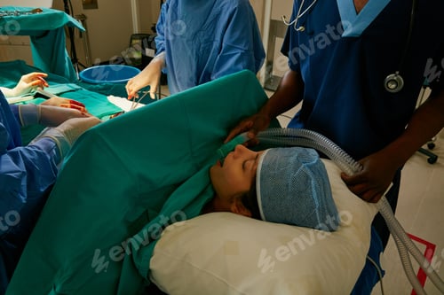 Preview: Shot of a team of surgeons performing a surgery in an operating room