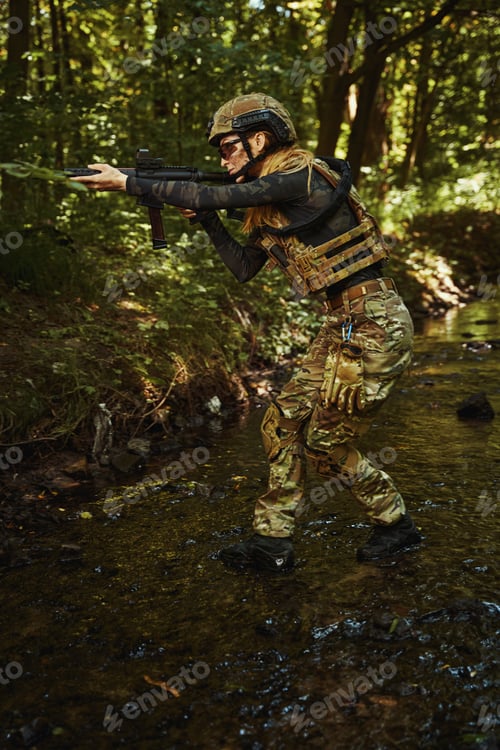 Preview: Woman in uniform using dangerous weapon outdoors
