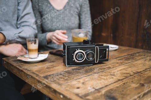 Preview: Retro video camera on cafe table