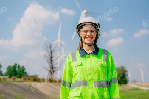 Preview: Professional engineer technician working outdoor at wind turbine field