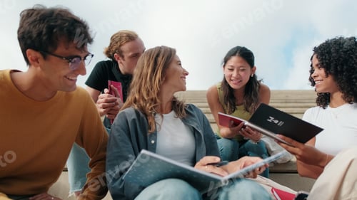 Preview: Group of Students Studying and Smiling on Steps