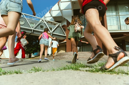 Preview: Happy kids playing at city's street in sunny summer's day