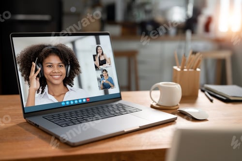 Preview: Laptop computer with people meeting online video conference screen display