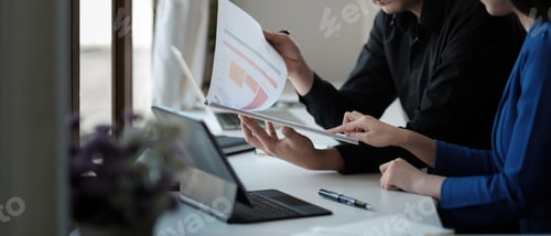 Preview: Business group or business partners discussing documents and ideas at meeting. business people