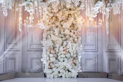 Preview: Floral wedding background with lush arrangements of white and pink flowers, candles and spotlights.