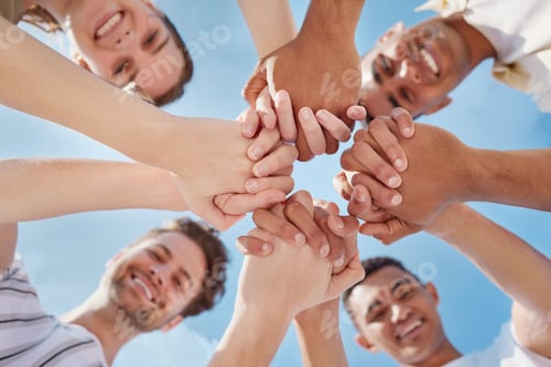 Preview: Shot of a group of young people holding hands outside