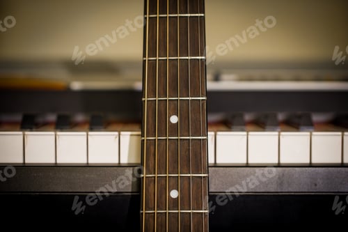 Preview: musical instruments piano keys and acoustic guitar