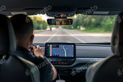 Preview: A male driver drives at speed through the streets of the city.