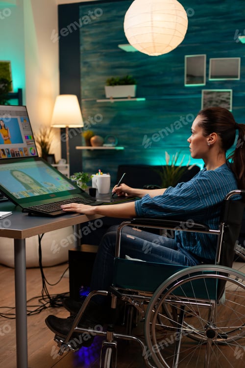 Preview: Disabled woman photographer in wheelchair working
