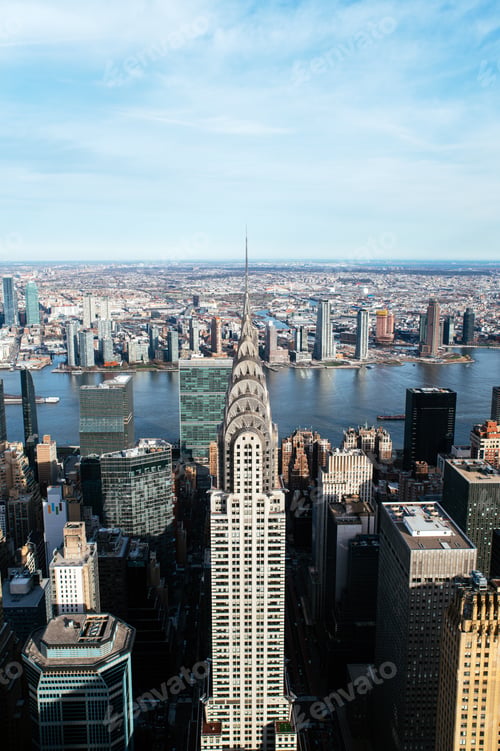 Preview: Scenic cityscape with modern skyscrapers and Chrysler Building at riverside
