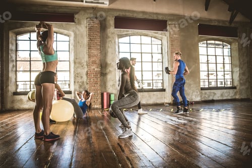 Preview: Athletes training in a gym
