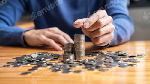 Preview: Man and pile coin to planning growing saving strategy with pile coins for future plan fund of travel
