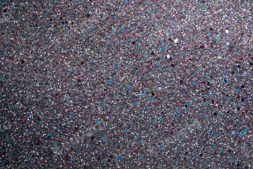 Preview: Shimmering glitter texture background with colorful specks on dark surface for creative design