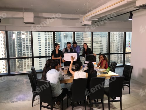 Preview: Group of people meeting and present plans in office