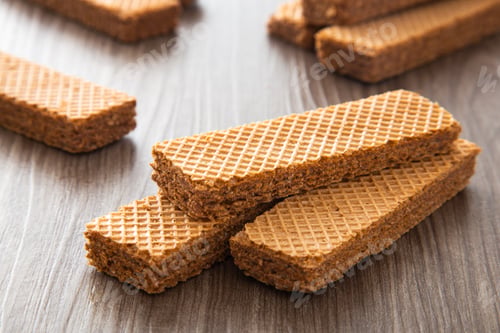 Preview: Chocolate wafer biscuit on dark wooden background.