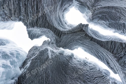 Preview: Ice cave with rock formation of water eroded on winter