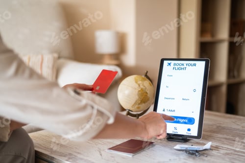 Preview: Digital tourism and online travel booking with woman using tablet, card and travel items