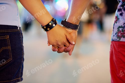 Preview: Ill always be by your side. Cropped shot of a couple holding hands while out in the city.