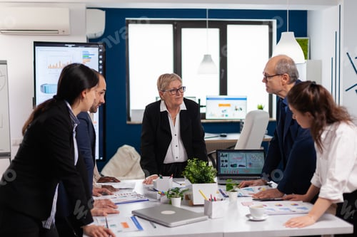 Preview: Group of diverse enthusiastic business people discussing
