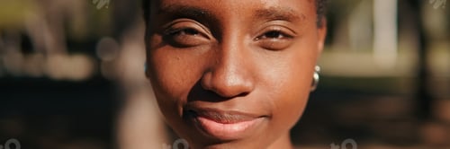 Preview: Close-up of happy young woman outdoors in the park. Panoramic. Panoramic