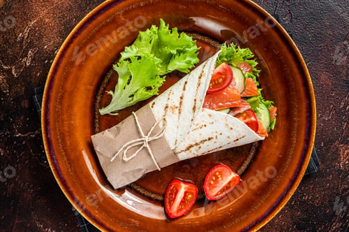 Preview: Wrap roll sandwich with fish salmon and vegetables. Dark background. Top view
