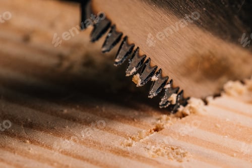 Preview: Detail of the teeth of a Japanese saw sawing.