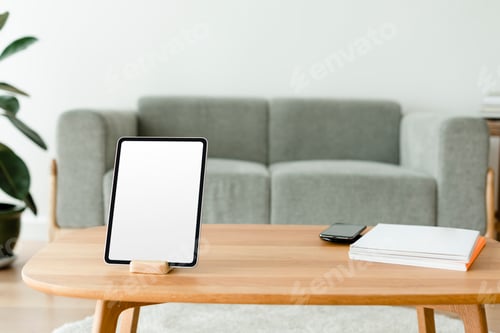 Preview: Digital tablet with blank screen on wooden table