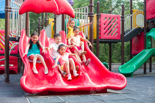 Preview: Happy children playing on slide