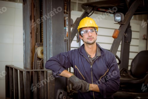 Preview: Portrait worker industry factory wear safety uniform factory drive a forklift car and open car light