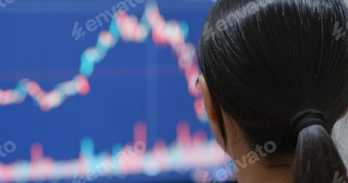 Preview: Woman watching the stock market graph