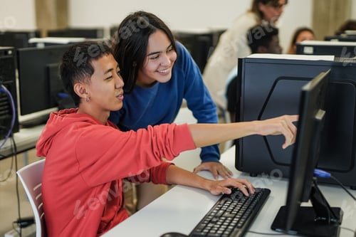 Preview: Young students working together on project inside computer class room - Back to school concept