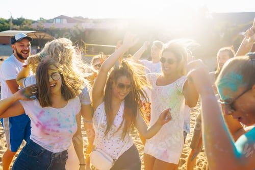 Preview: Teenagers Friends have fun at holi festival. Beach Party. Celebrating traditional spring holiday.