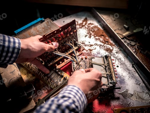 Preview: hand repairing computer mother boards and othe electric boards in workshop