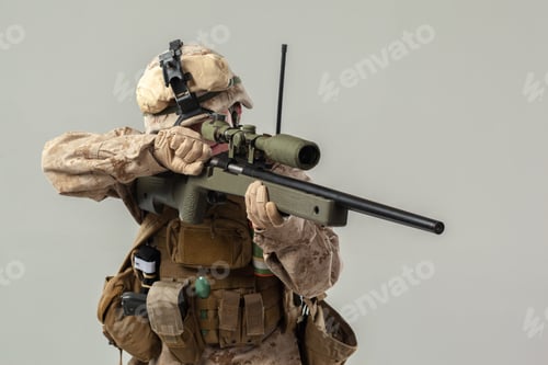 Preview: Soldier aiming rifle in military uniform during a training exercise indoors