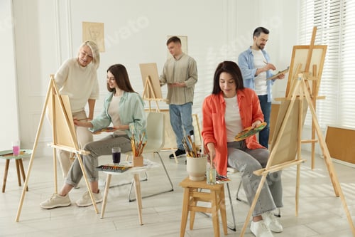 Preview: Artist and her students having painting class in studio