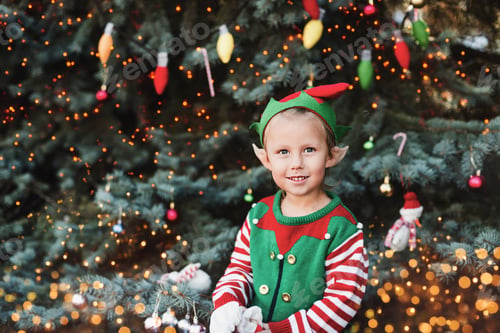 Preview: Christmas in july. Child waiting for Christmas in wood in july