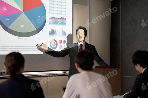 Preview: Asian businessman giving a presentation at a conference