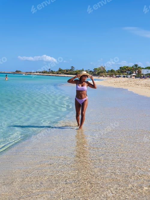 Preview: A carefree stroll along the tranquil beach at midday, embracing the sun and sea breeze