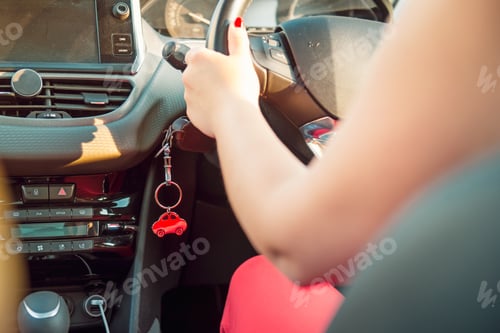 Preview: Car key in ignition. Start, stop, accelerate engine. Car shape keyfob on vehicle dashboard backgroun