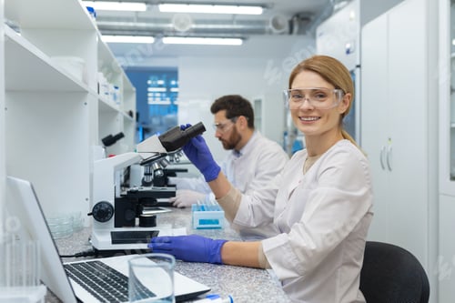 Preview: Portrait of female scientist laboratory assistant, researcher working inside medical laboratory