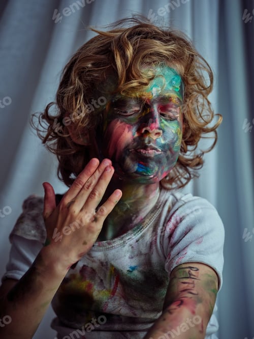 Preview: Dirty boy smearing paint on face