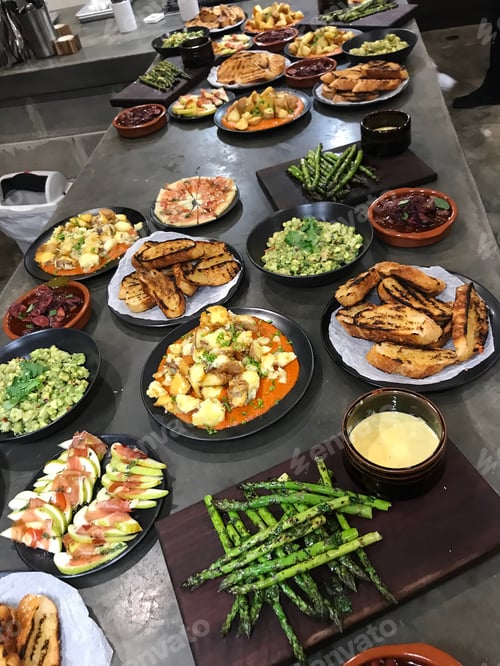 Preview: A buffet of Mediterranean grilled foods laid out in the kitchen ready to be served