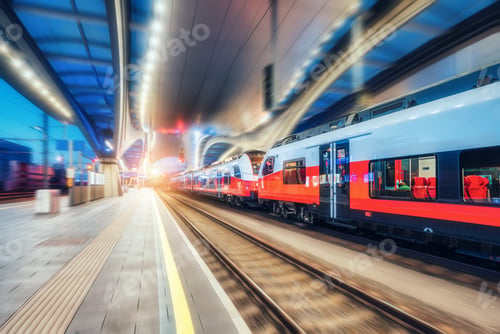 Preview: High speed train in motion on the railway station at night
