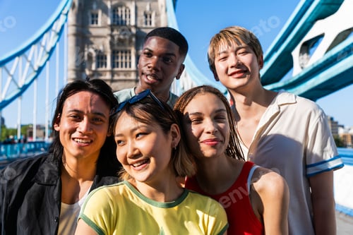 Preview: Multiracial group of happy young friends bonding in London