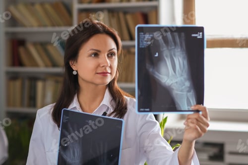 Woman Doctor Examining X-rays in Office Setting