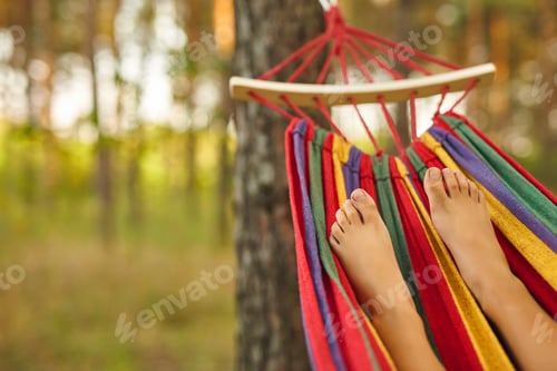 Preview: Child's Feet Relaxing in a Hammock