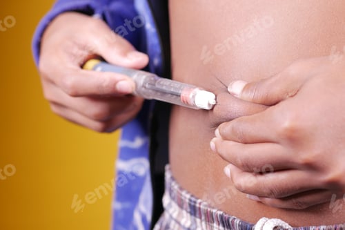 Preview: young man hand using insulin pen close up